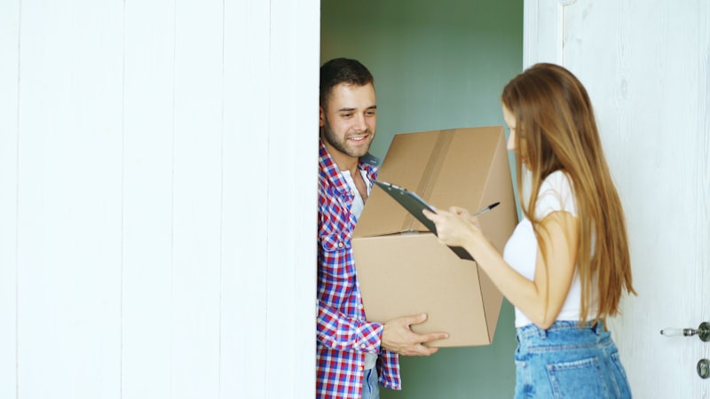 An Apex Courier International courier handing over a package